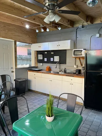 a patio with a table and chairs