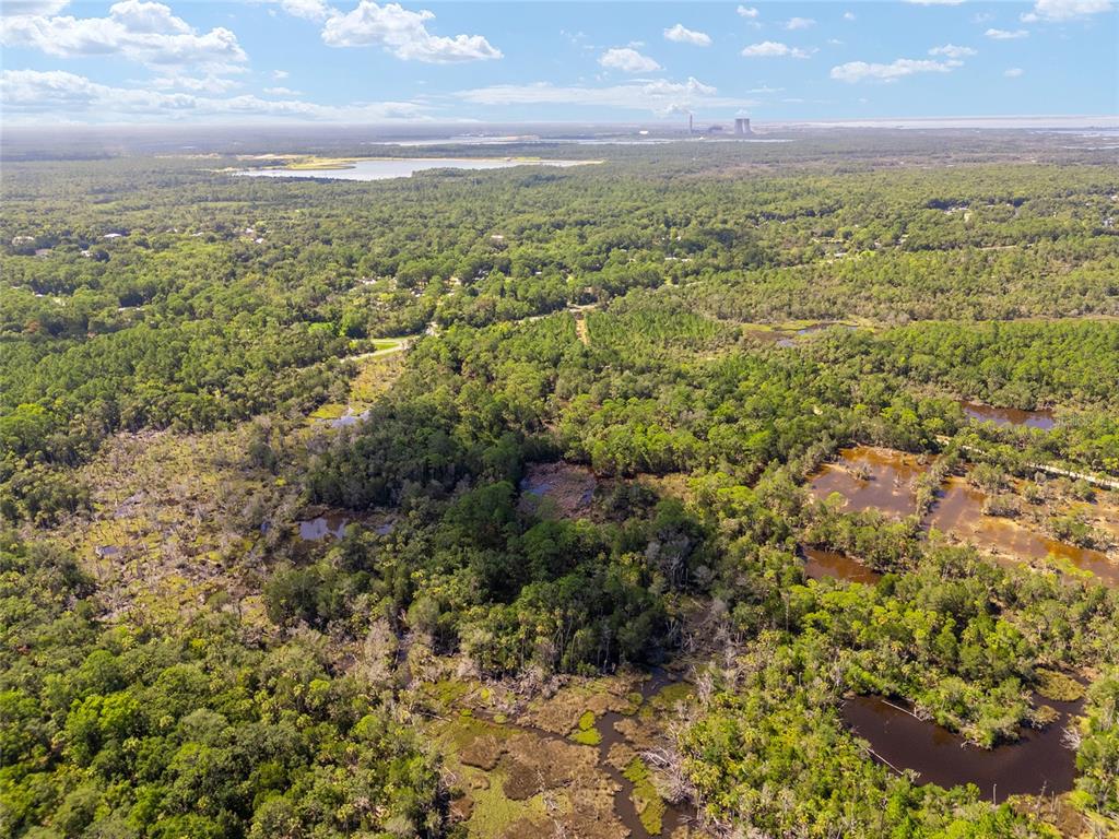 0 Southeast 193rd Place Yankeetown, FL 34498 - Photo 7 of 31 a view of a city with green field