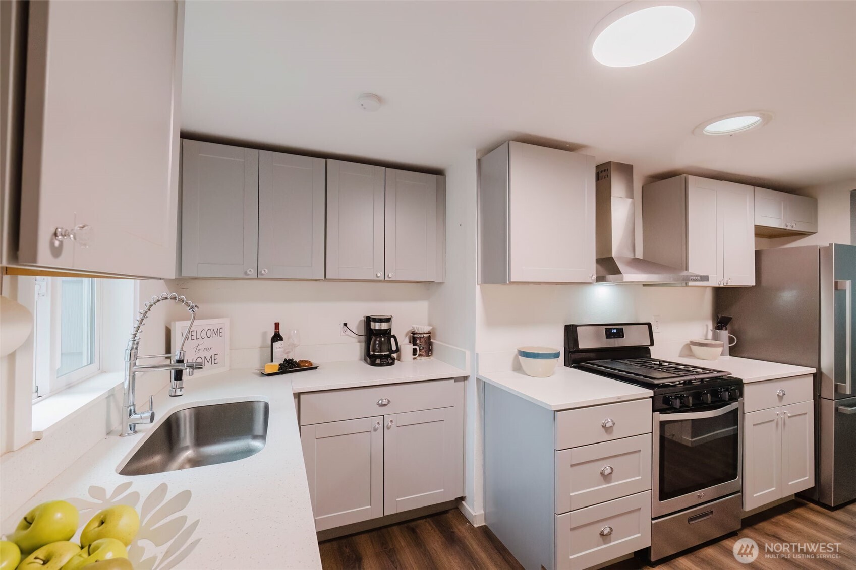 2805 Bowen Street Bremerton, WA 98310 - Photo 14 of 40 a kitchen with white cabinets sink and white appliances