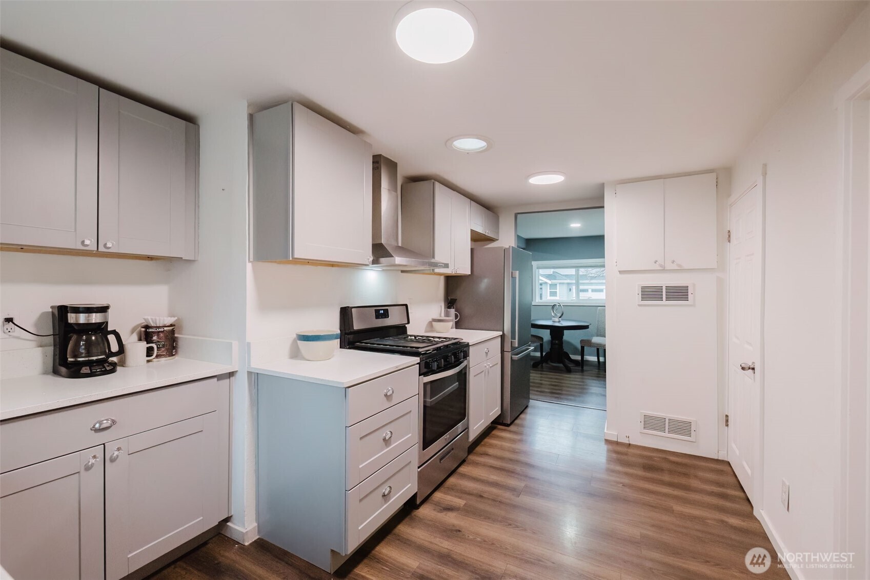 2805 Bowen Street Bremerton, WA 98310 - Photo 16 of 40 a kitchen with stainless steel appliances granite countertop a stove a sink and a refrigerator
