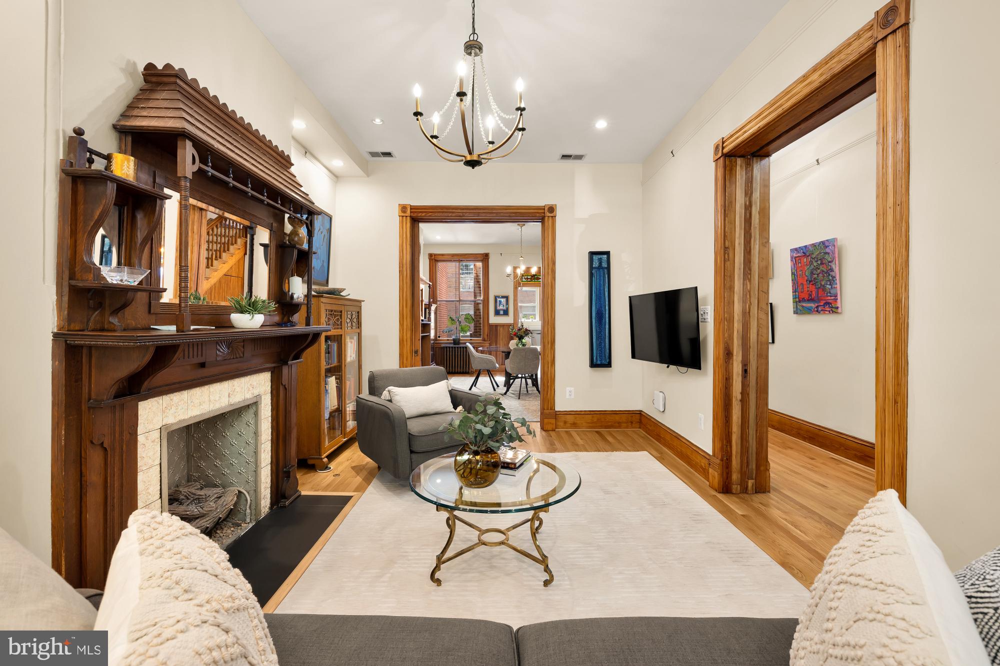 1214 T Street Northwest Washington, DC 20009 - Photo 14 of 88 a living room with furniture a flat screen tv and a fireplace