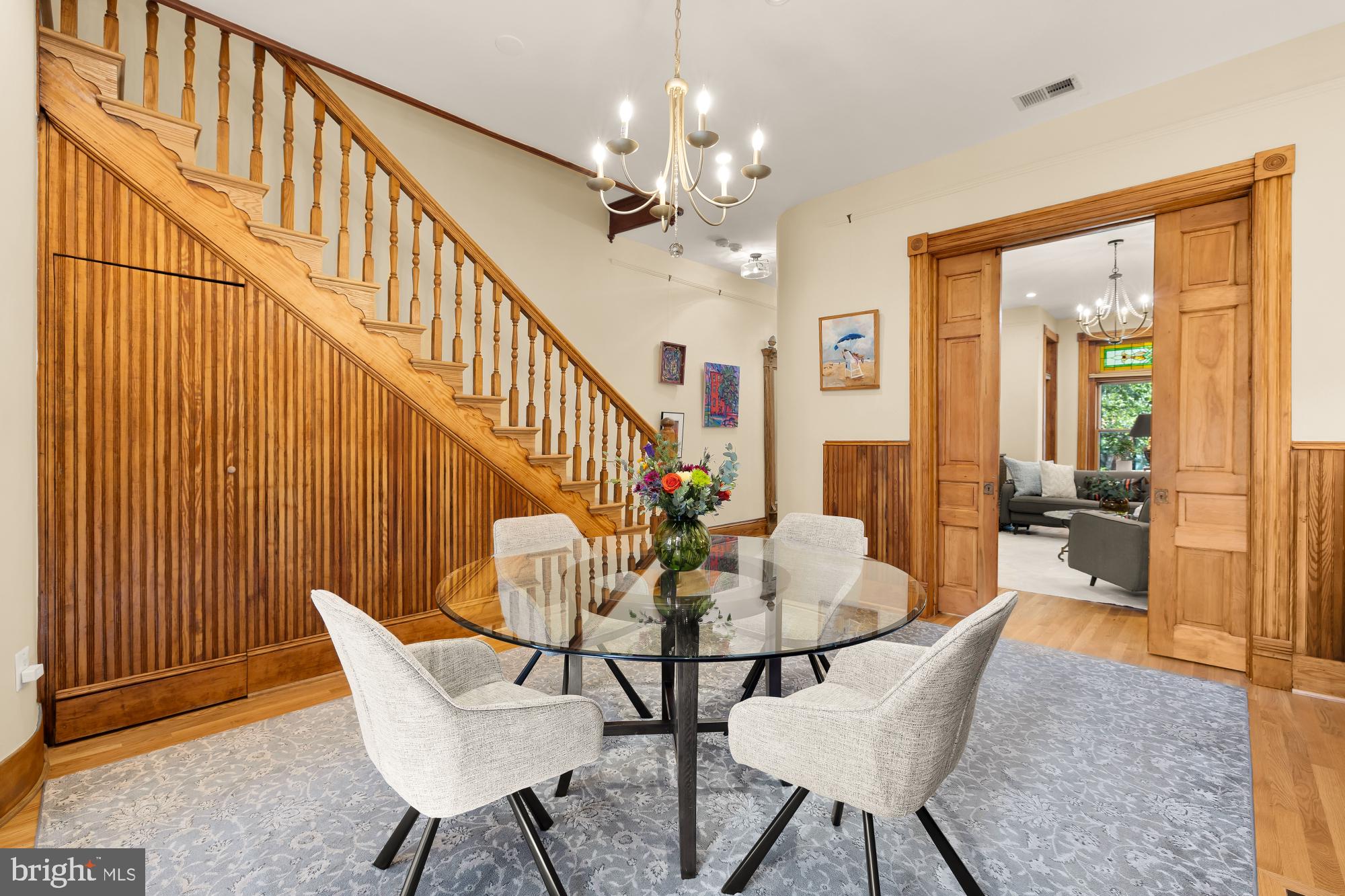 1214 T Street Northwest Washington, DC 20009 - Photo 21 of 88 a view of a dining room with furniture and a chandelier