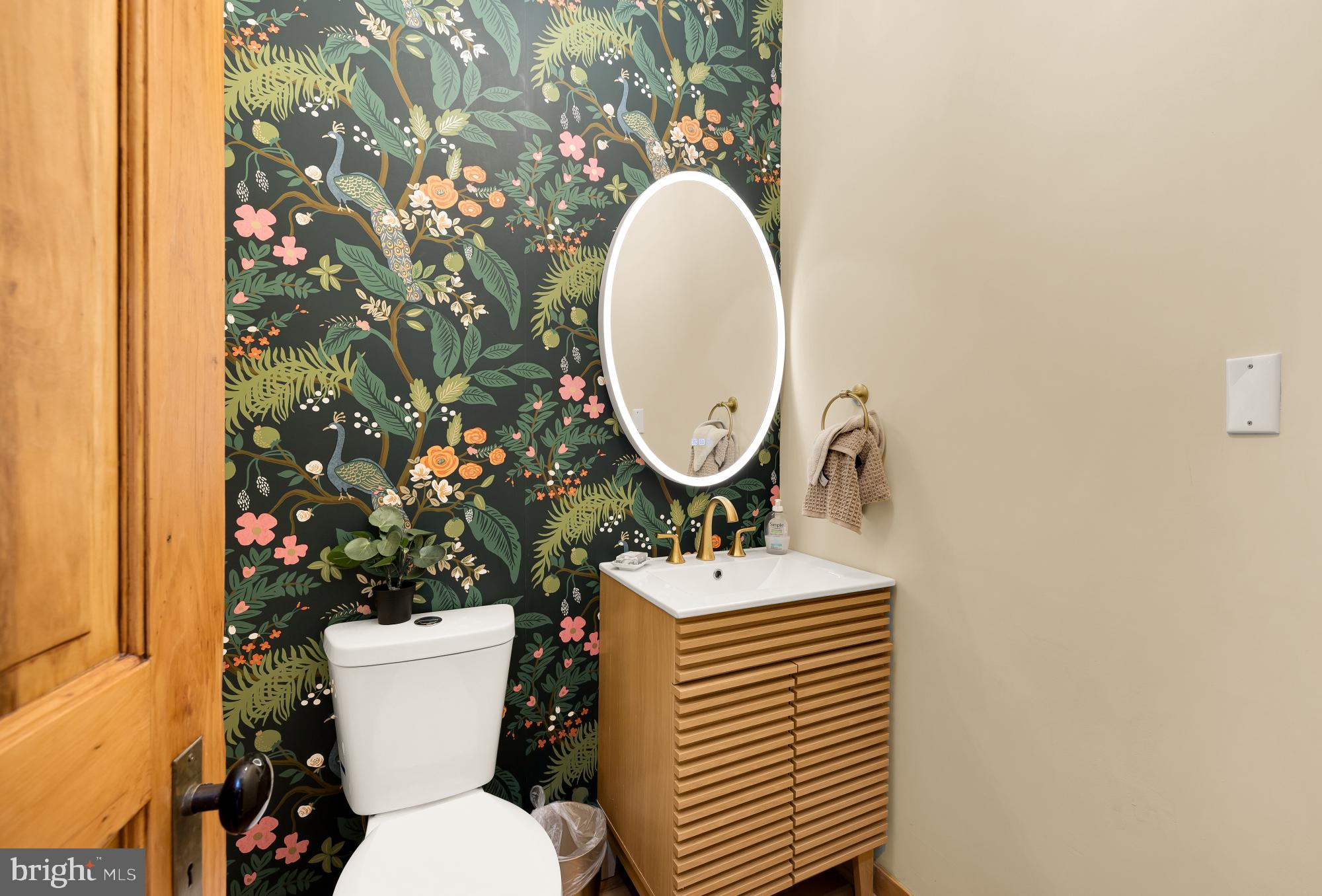 1214 T Street Northwest Washington, DC 20009 - Photo 22 of 88 a bathroom with a toilet sink and mirror