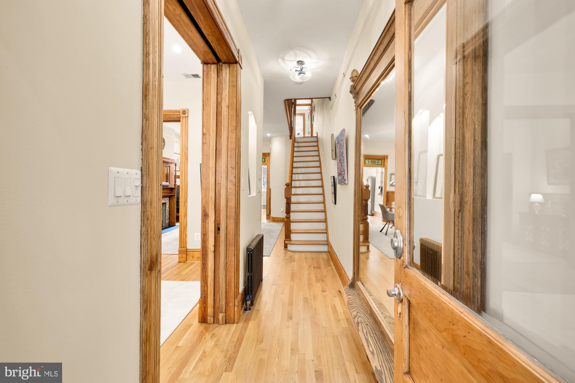 1214 T Street Northwest Washington, DC 20009 - Photo 3 of 88 a view of a hallway with wooden floor and staircase