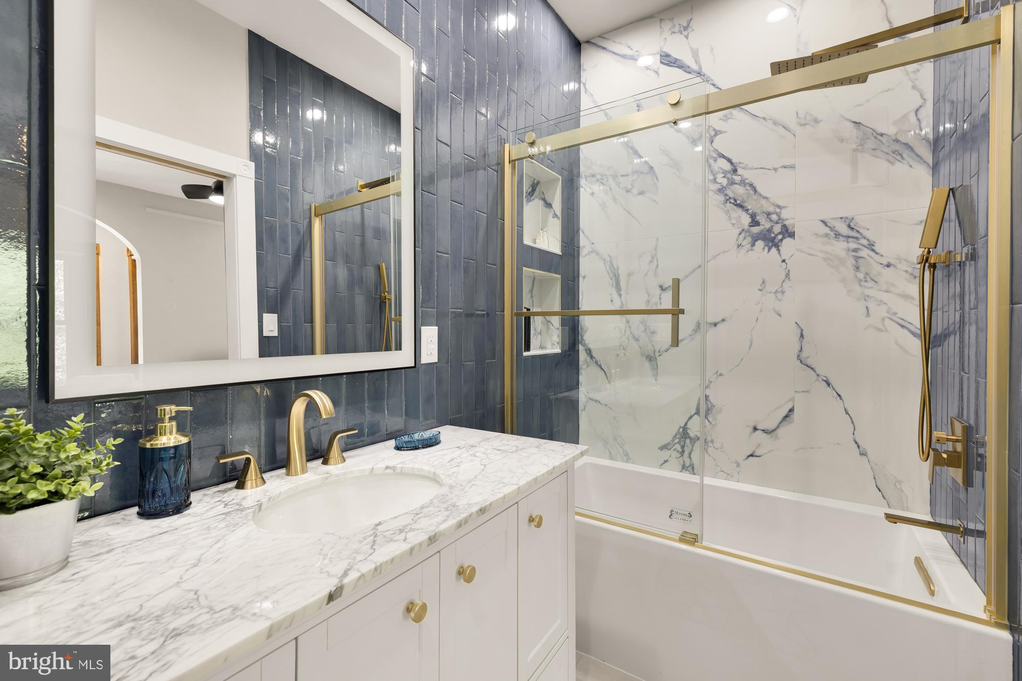 1214 T Street Northwest Washington, DC 20009 - Photo 32 of 88 a bathroom with a granite countertop sink a mirror and shower
