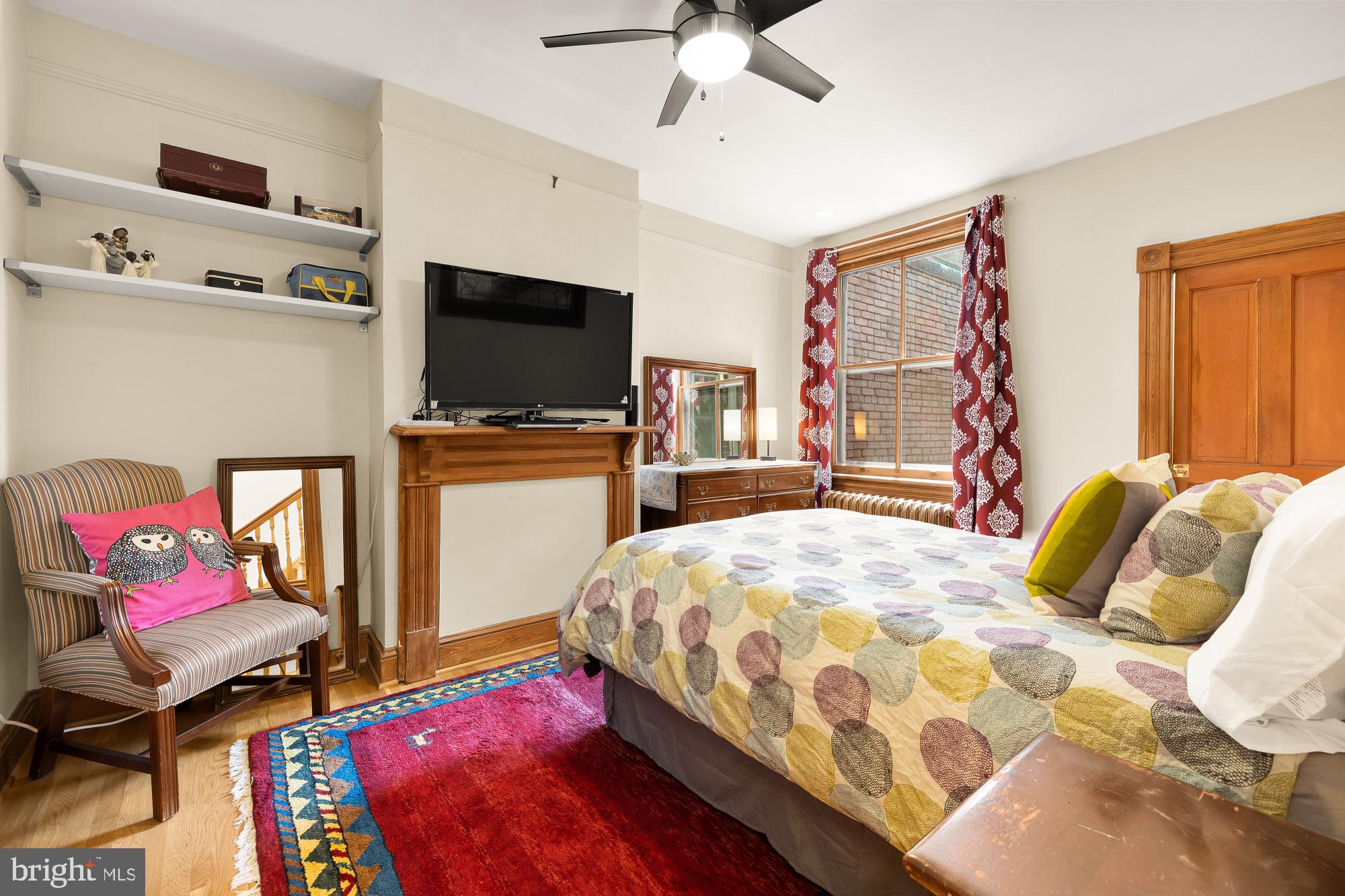 1214 T Street Northwest Washington, DC 20009 - Photo 33 of 88 a bedroom with a bed and flat screen tv