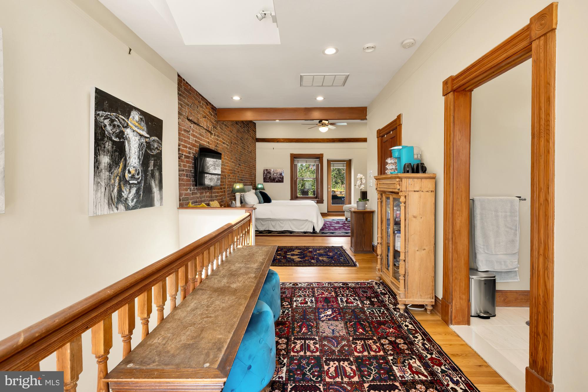 1214 T Street Northwest Washington, DC 20009 - Photo 41 of 88 a view of a hallway with wooden floor and furniture