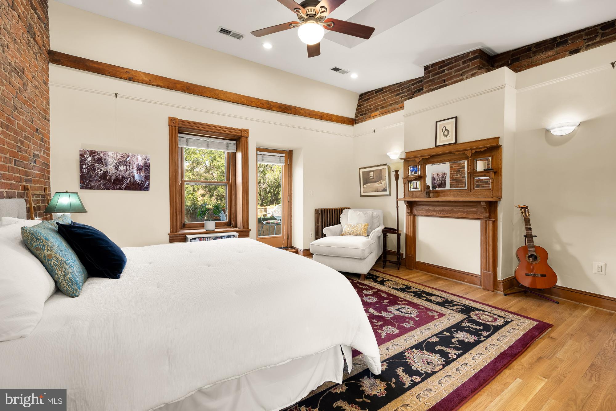 1214 T Street Northwest Washington, DC 20009 - Photo 47 of 88 a bedroom with a bed and wooden floor