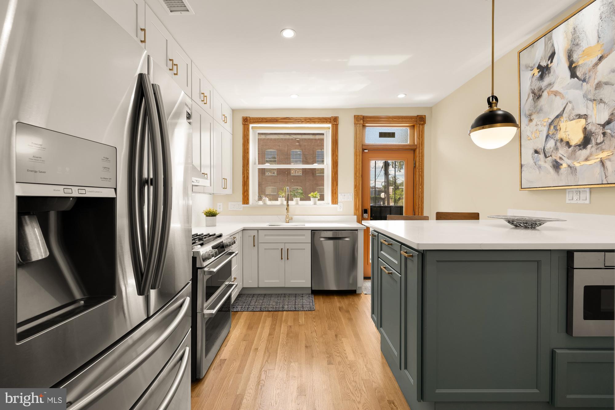 1214 T Street Northwest Washington, DC 20009 - Photo 5 of 88 a kitchen with a sink stove and refrigerator