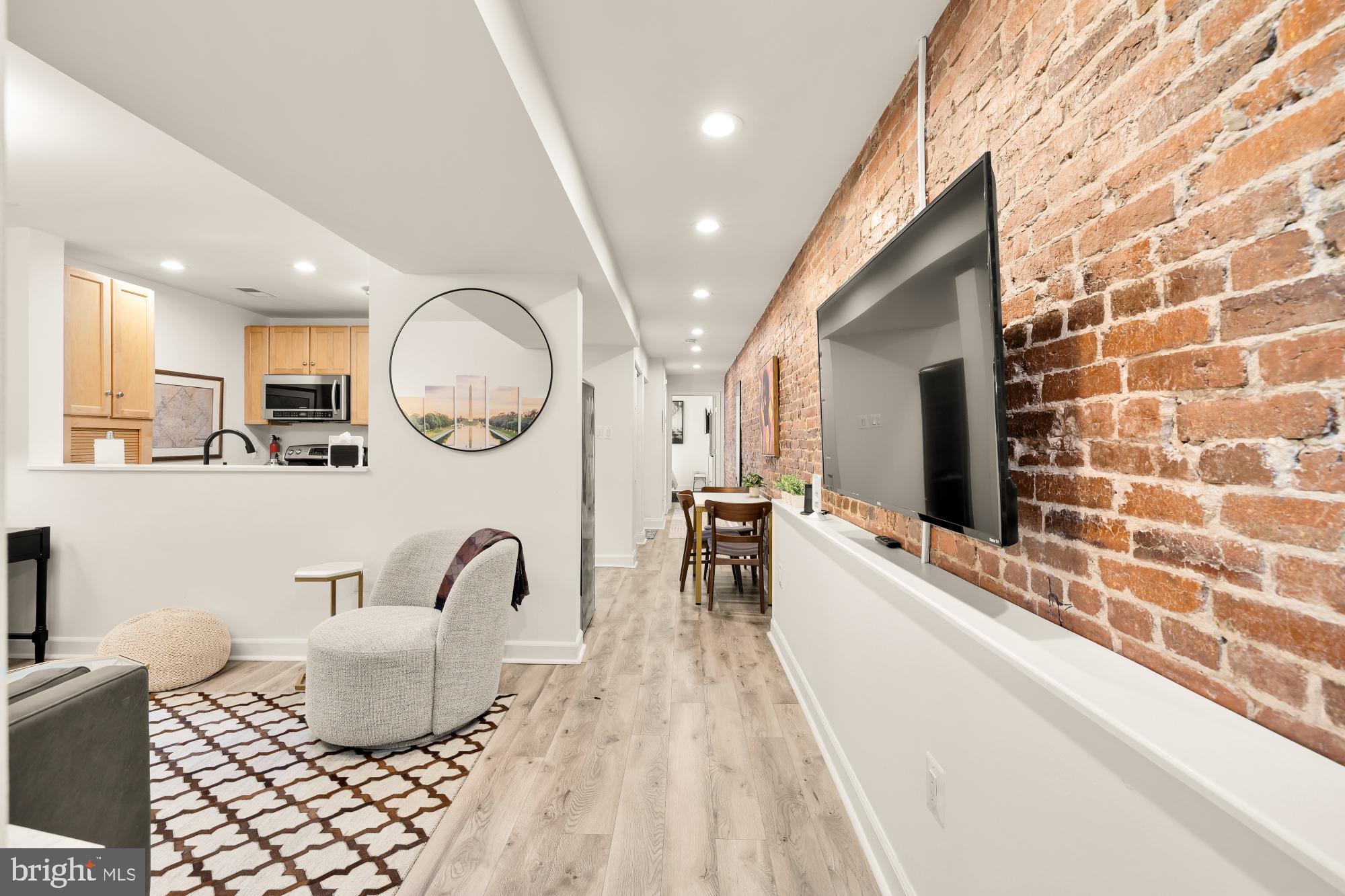 1214 T Street Northwest Washington, DC 20009 - Photo 58 of 88 a living room with furniture and a flat screen tv