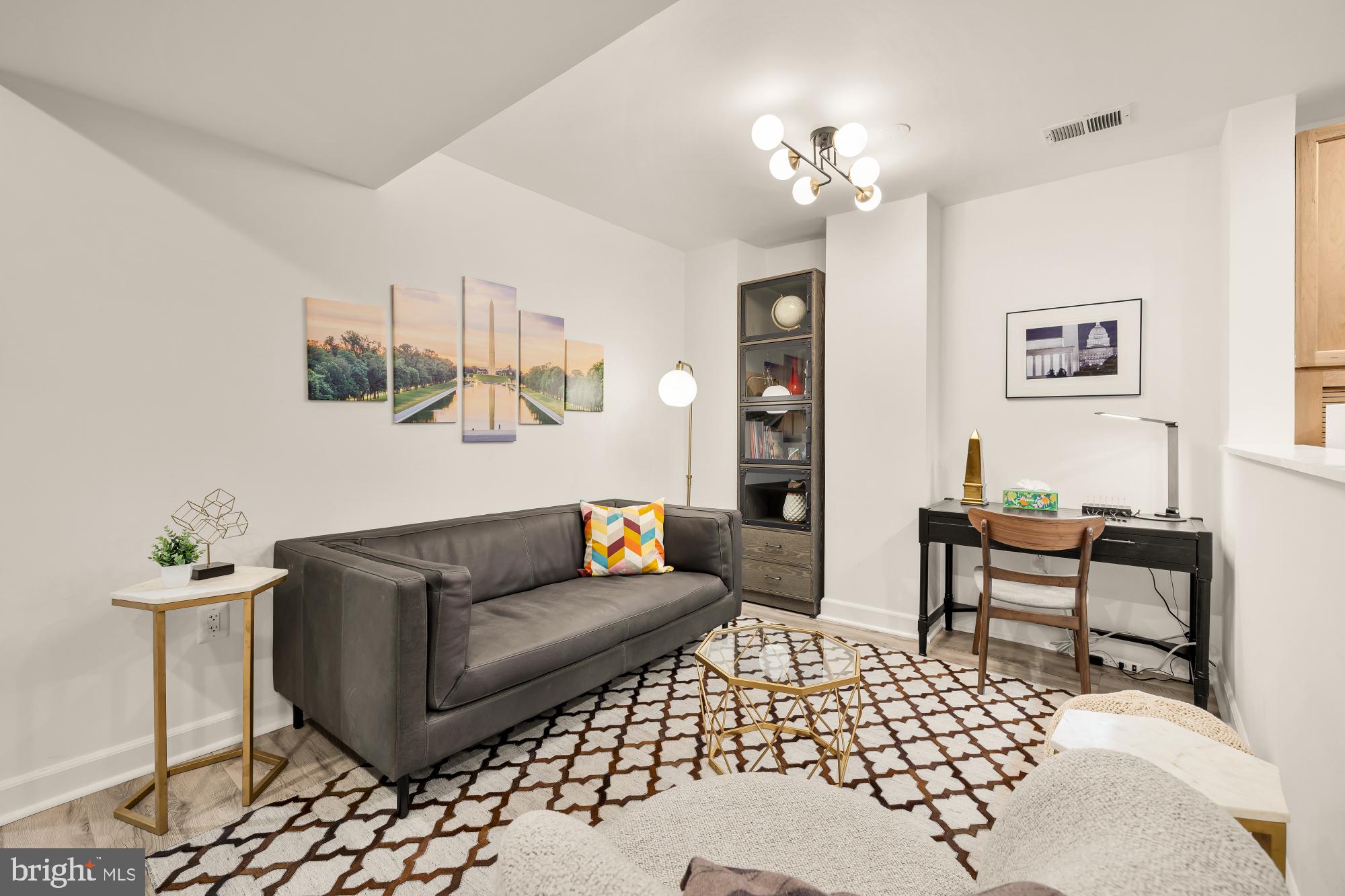 1214 T Street Northwest Washington, DC 20009 - Photo 59 of 88 a living room with furniture and a chandelier