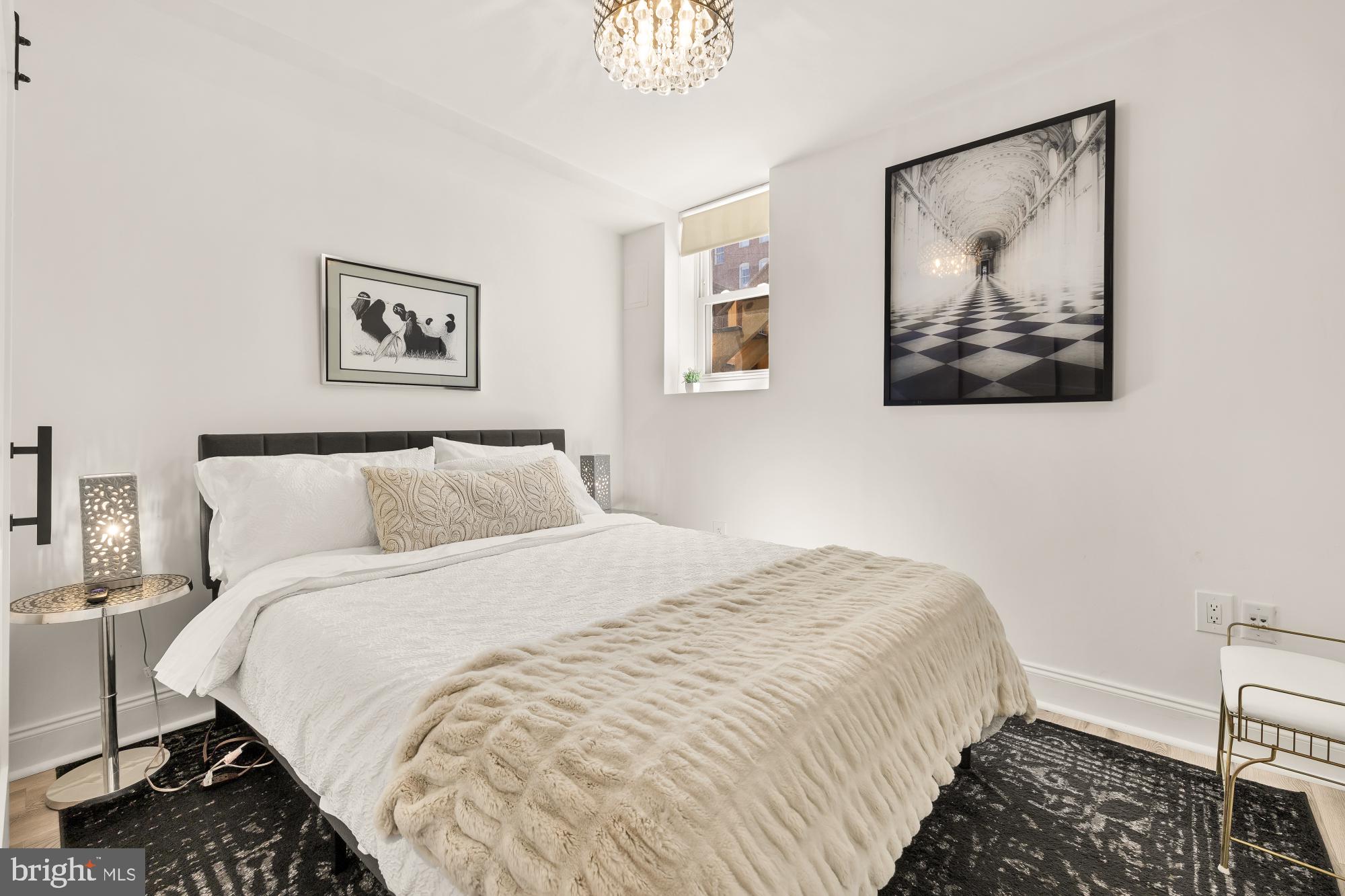 1214 T Street Northwest Washington, DC 20009 - Photo 72 of 88 a bedroom with bed and wall painting with wooden floor