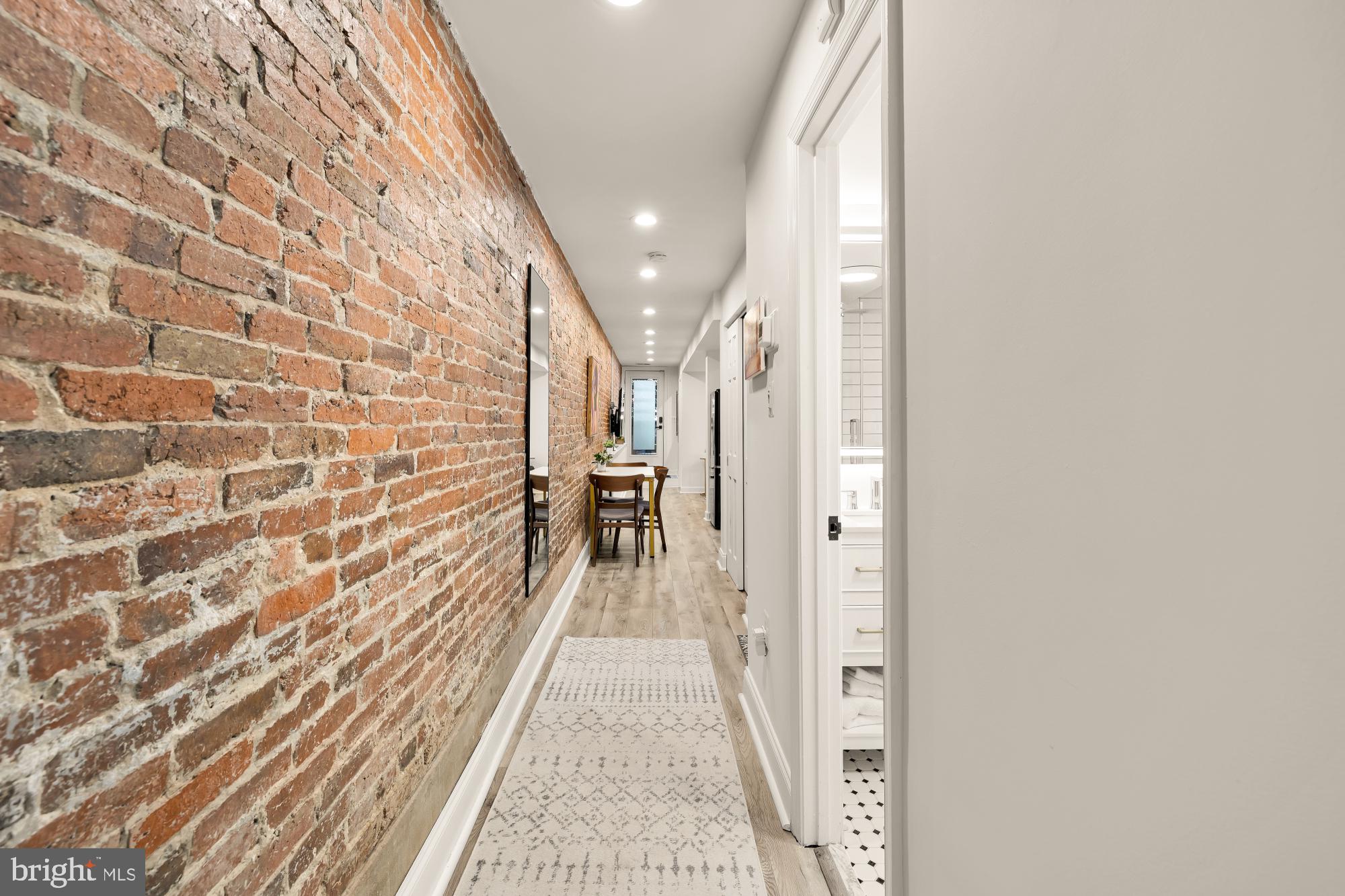 1214 T Street Northwest Washington, DC 20009 - Photo 74 of 88 a view of a hallway with wooden floor and staircase