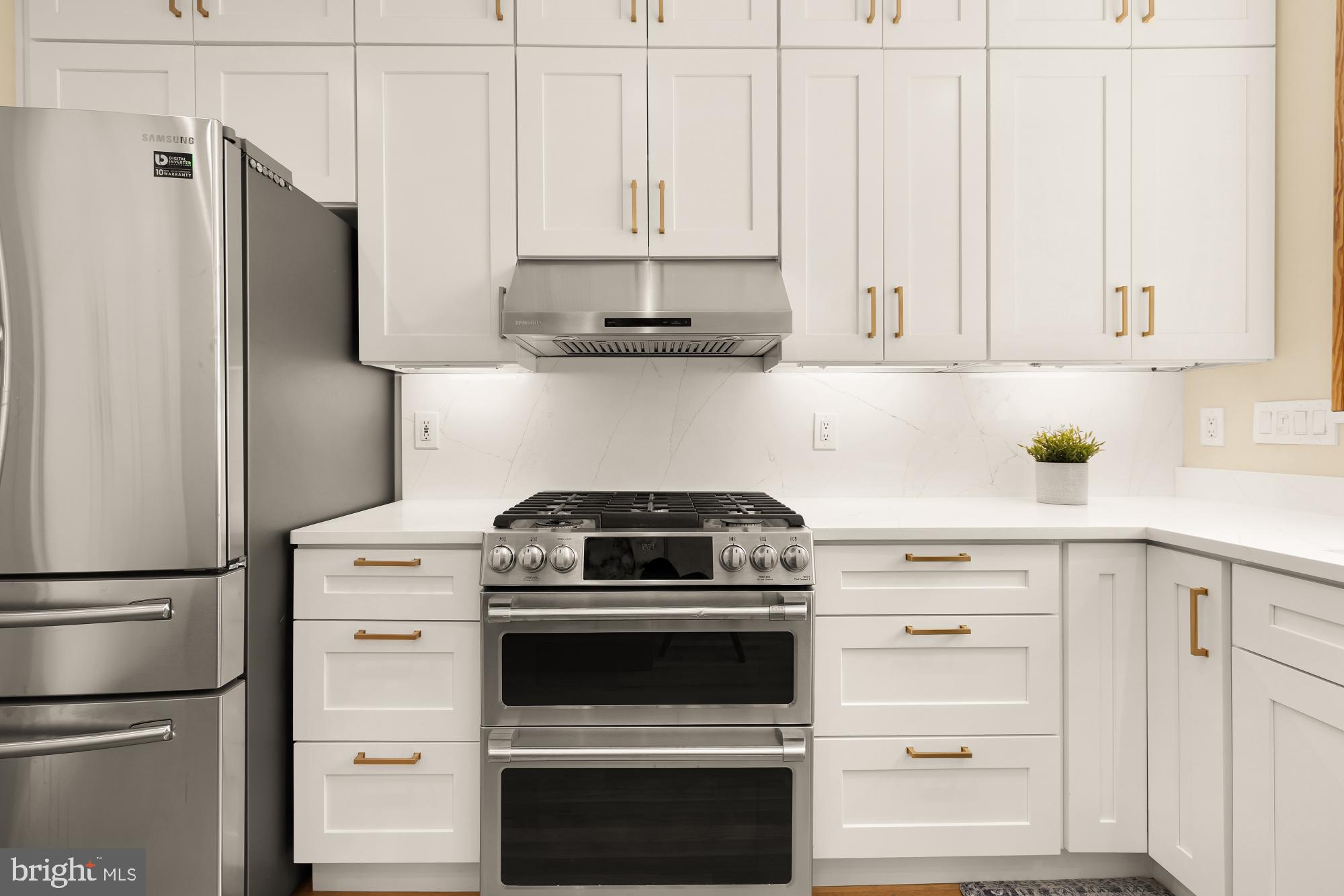 1214 T Street Northwest Washington, DC 20009 - Photo 8 of 88 a kitchen with stainless steel appliances white cabinets and a refrigerator
