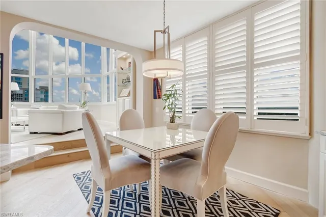 a view of a dining room with furniture and window