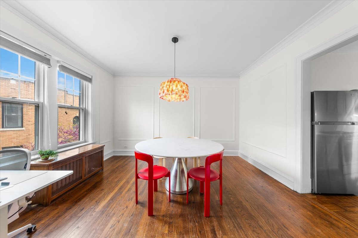 602 Sheridan Road, Unit 3E Evanston, IL 60202 - Photo 11 of 21 a view of a dining room with furniture window and wooden floor