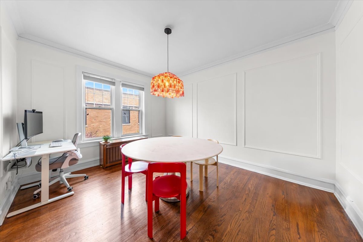 602 Sheridan Road, Unit 3E Evanston, IL 60202 - Photo 12 of 21 a view of a dining room with furniture window and wooden floor