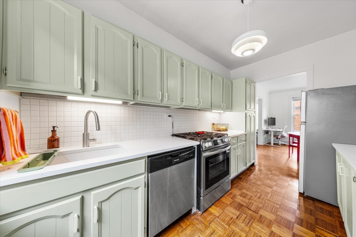 602 Sheridan Road, Unit 3E Evanston, IL 60202 - Photo 16 of 21 a kitchen with stainless steel appliances granite countertop a sink stove and refrigerator