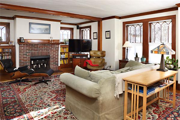 41 Pershing Road Boston, MA 02130 - Photo 2 of 8 a living room with furniture fireplace and flat screen tv