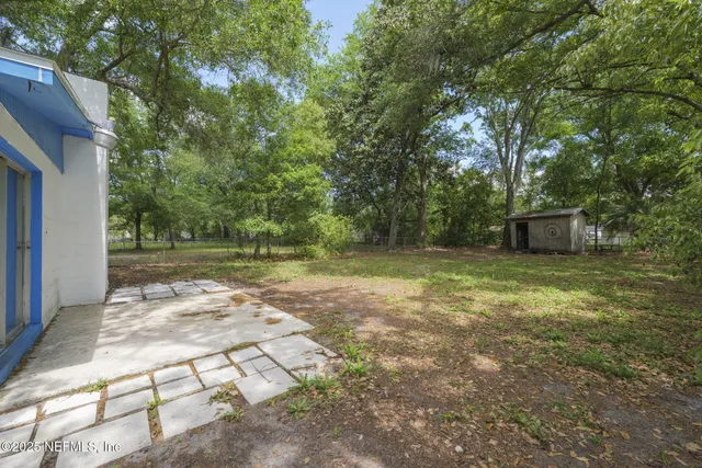 a backyard of a house with lots of green space