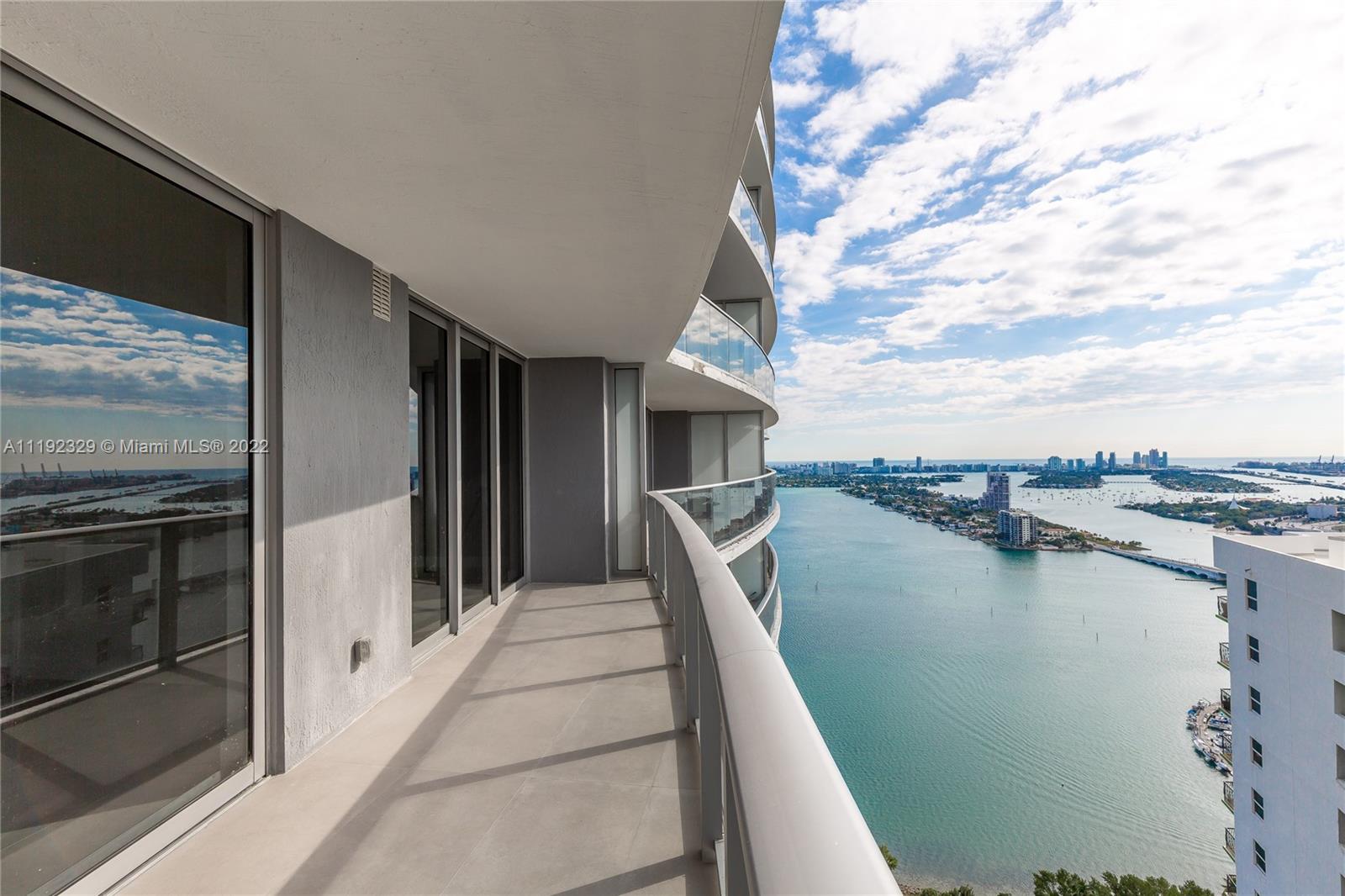 a view of a balcony with an ocean
