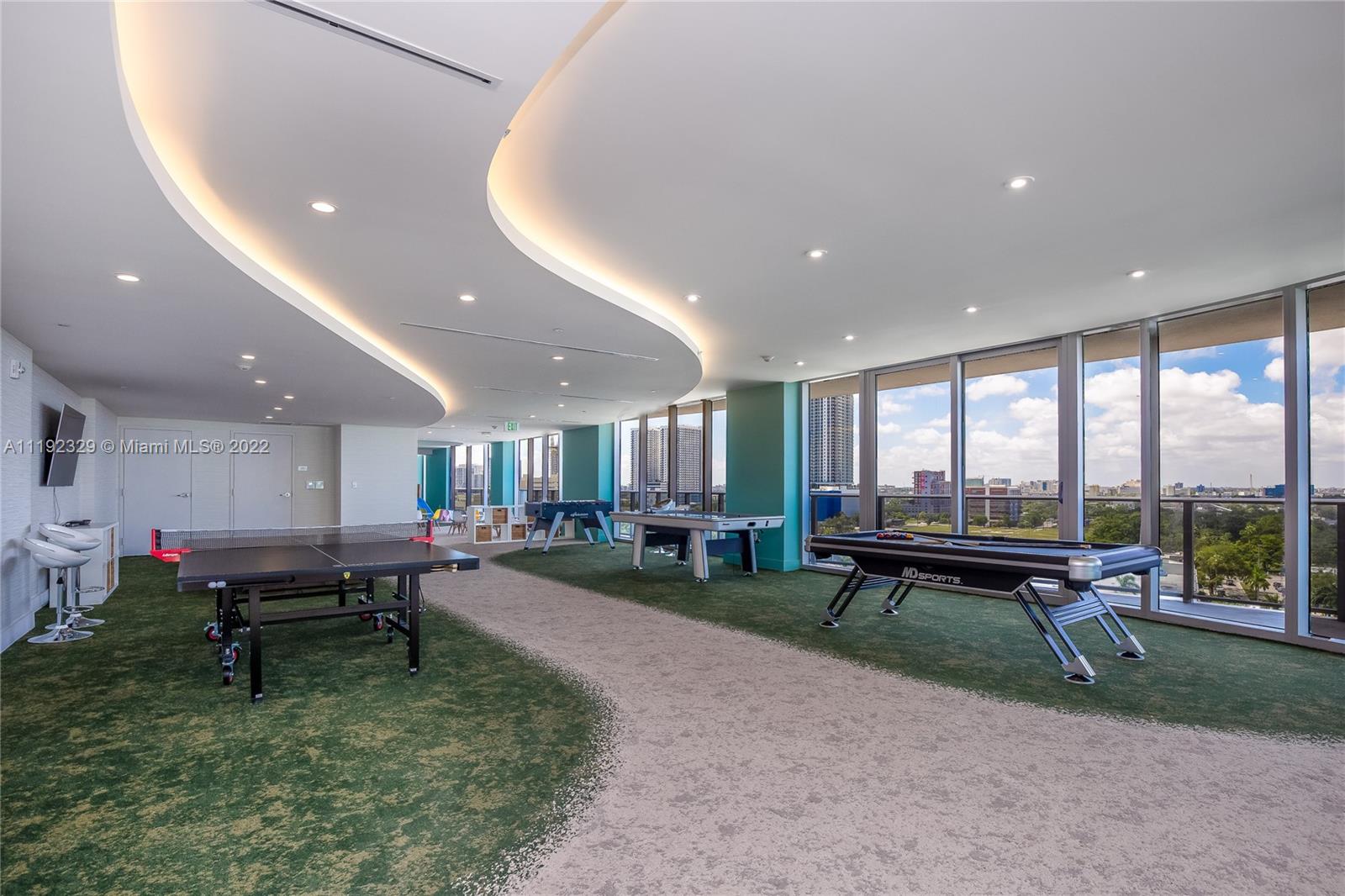 488 Northeast 18th Street, Unit 3606 Miami, FL 33132 - Photo 5 of 18 a living room with lots of furniture and a floor to ceiling window