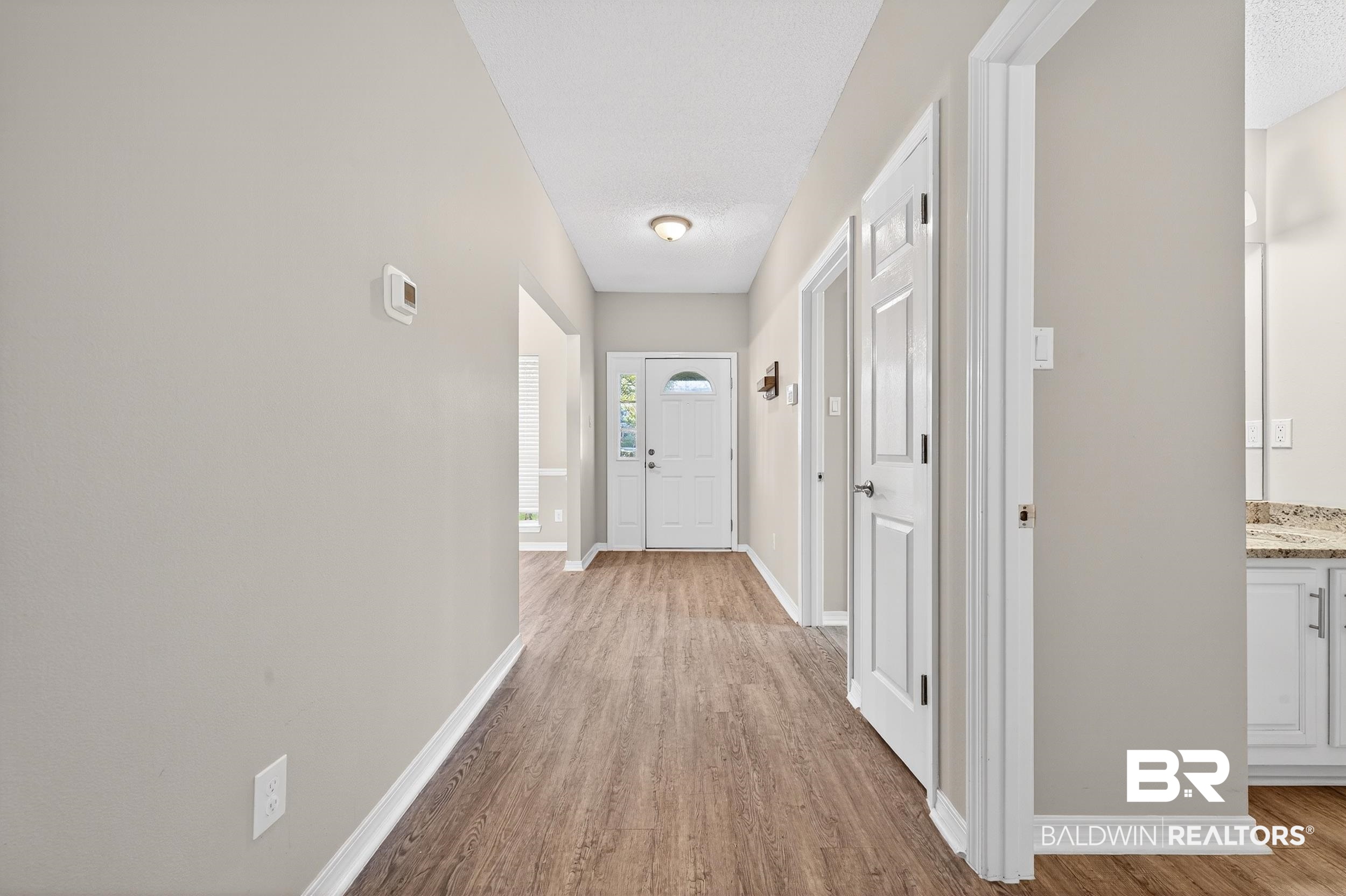 7050 Highpointe Place West Daphne, AL 36527 - Photo 8 of 66 Hallway featuring light wood-type flooring