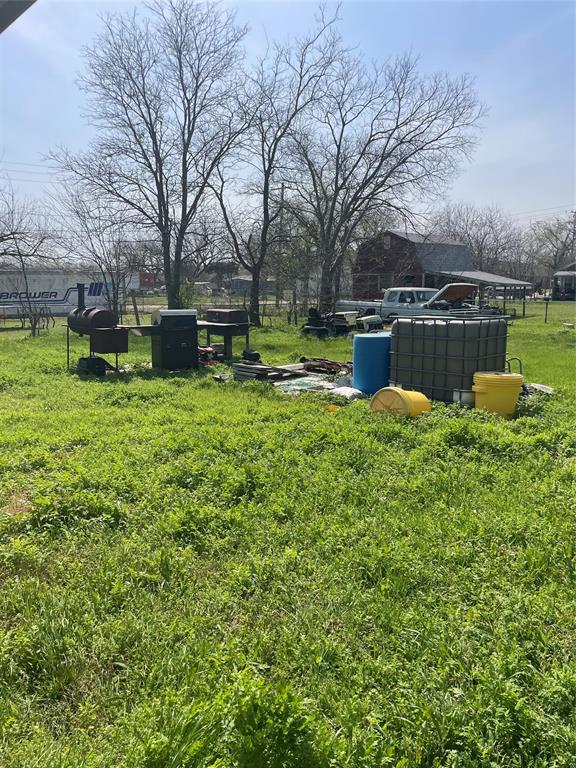 403 South 1st Street Sanger, TX 76266 - Photo 2 of 12 a view of a house with a yard