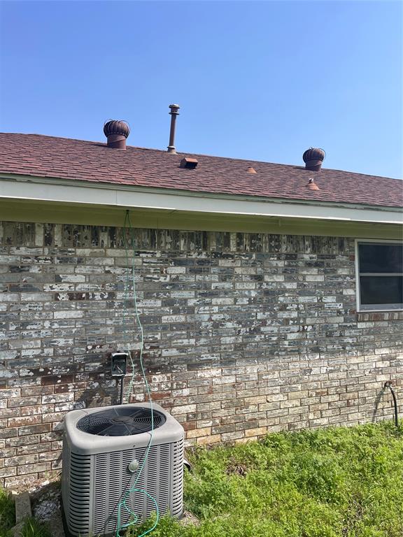 403 South 1st Street Sanger, TX 76266 - Photo 3 of 12 a front view of a house with a garden