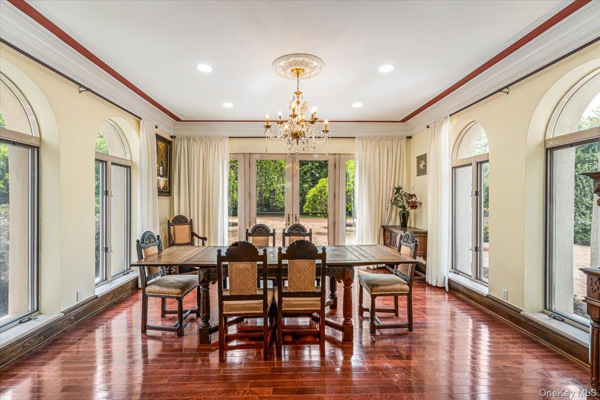 952 Cedar Swamp Road Glen Head, NY 11545 - Photo 12 of 50 a view of a a dining room with furniture window and wooden floor