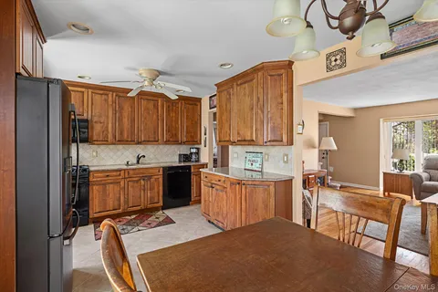 a kitchen with a sink refrigerator and cabinets