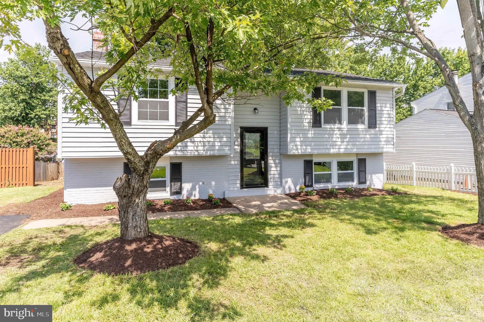 131 North Garfield Road Sterling, VA 20164 - Photo 1 of 13 Charming split-level home with lush greenery.