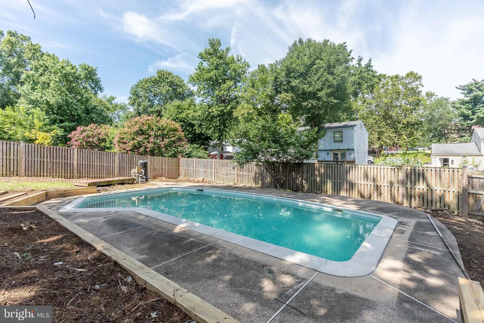131 North Garfield Road Sterling, VA 20164 - Photo 13 of 13 Serene backyard oasis with inviting pool.