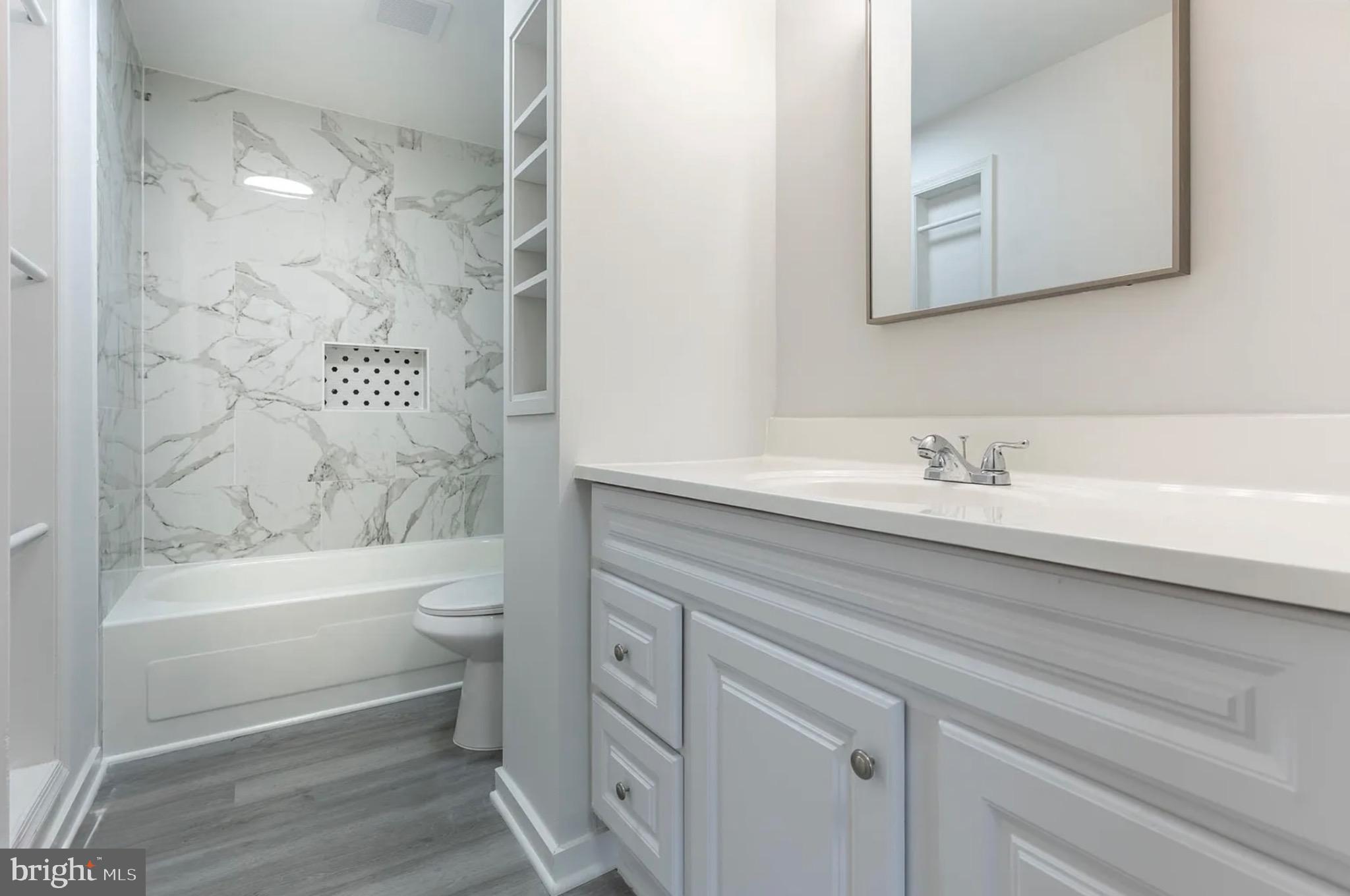 131 North Garfield Road Sterling, VA 20164 - Photo 5 of 13 Sleek modern bathroom with elegant finishes.