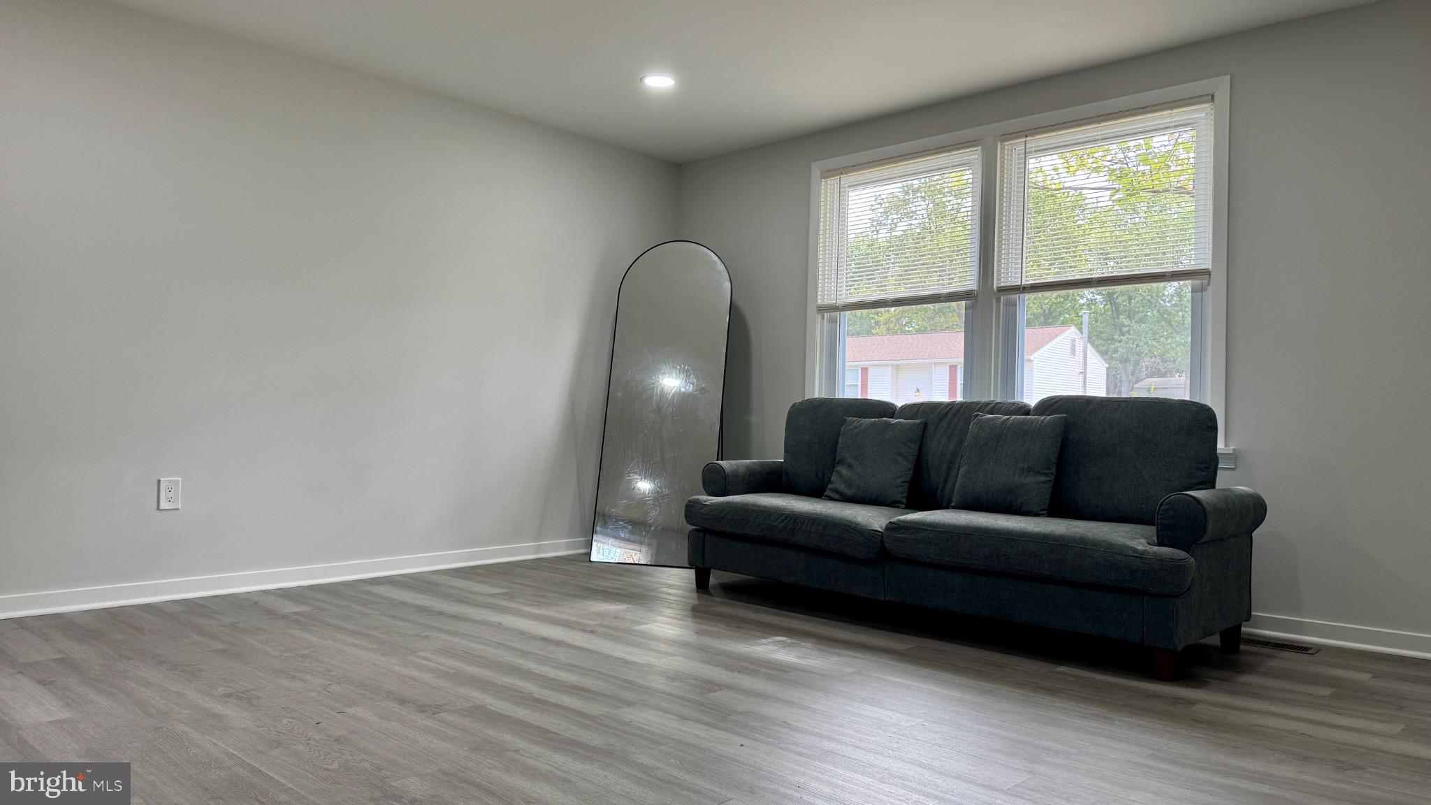 131 North Garfield Road Sterling, VA 20164 - Photo 7 of 13 Spacious living area with natural light.