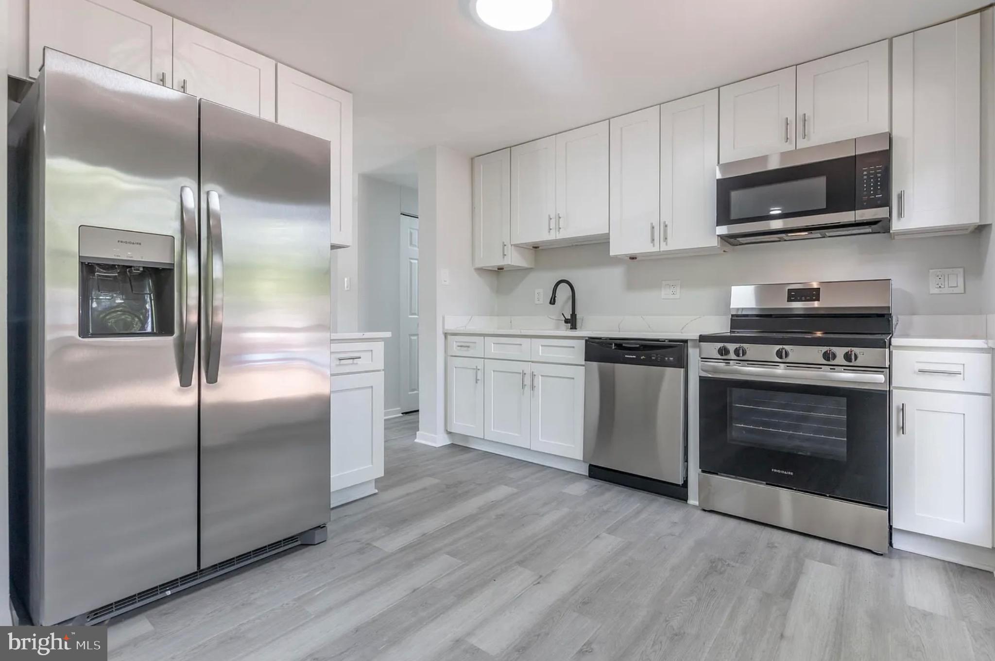 131 North Garfield Road Sterling, VA 20164 - Photo 9 of 13 Modern kitchen with sleek stainless appliances.