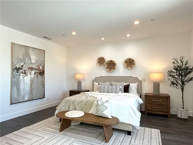 a bed room with a bed and a lamp