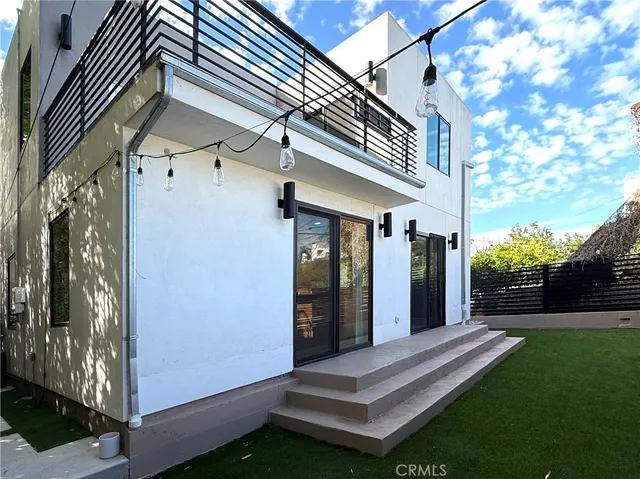 a view of house with yard