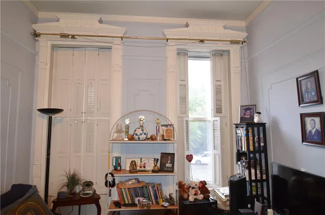 a view of hallway with a view of bedroom