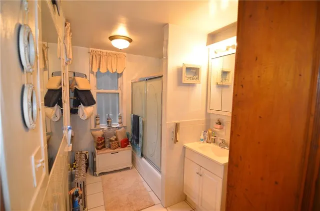 a view of a house with many windows and plants