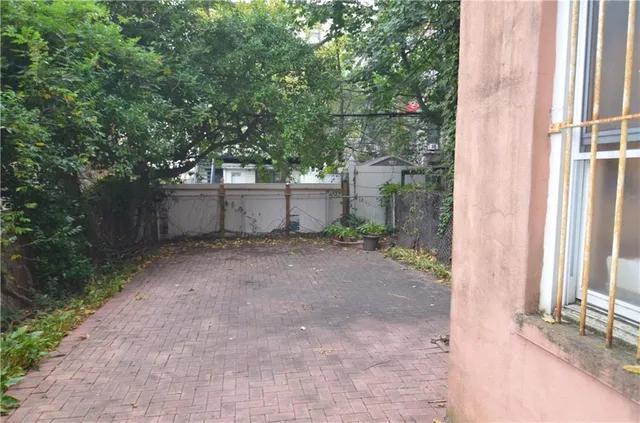 front view of a house with a tree