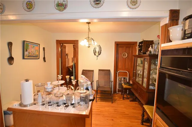 a living room with furniture a flat screen tv and a window