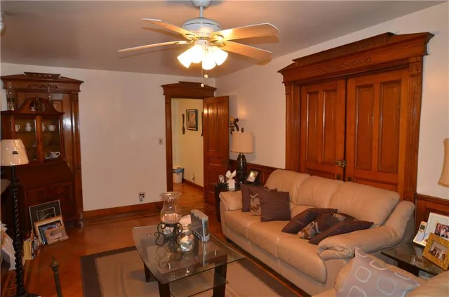 a bedroom with a bed and a book shelf