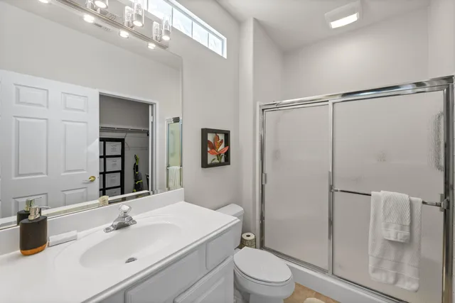 a view of a porch with furniture and a yard