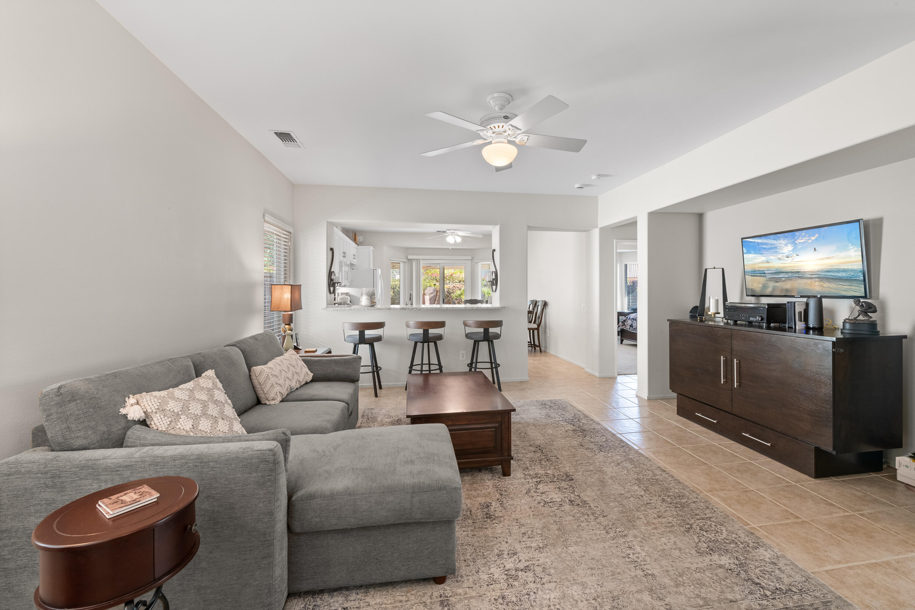 78680 Postbridge Circle Palm Desert, CA 92211 - Photo 2 of 54 a living room with furniture and a wooden floor