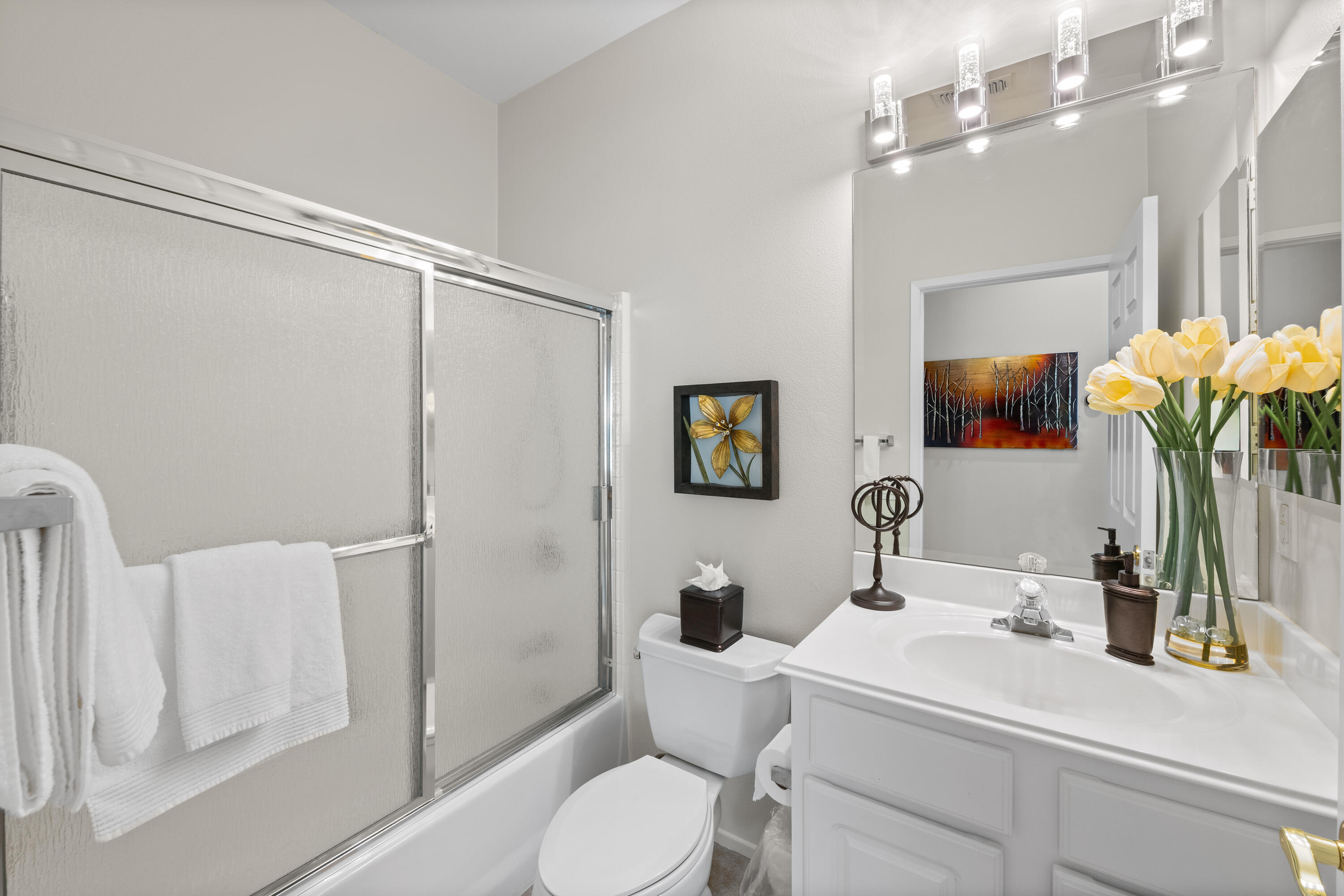 78680 Postbridge Circle Palm Desert, CA 92211 - Photo 21 of 54 a bathroom with a toilet sink and mirror