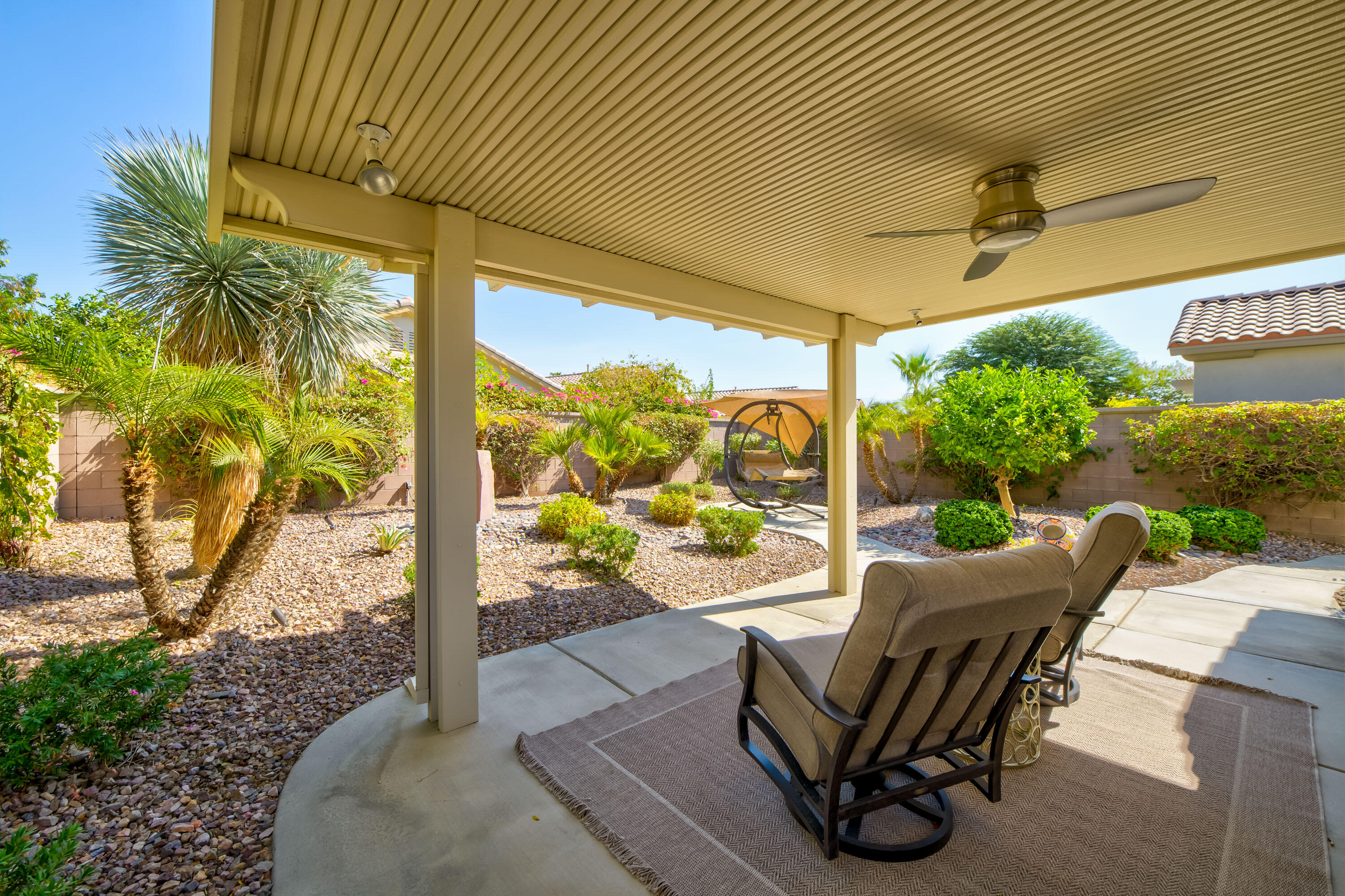 78680 Postbridge Circle Palm Desert, CA 92211 - Photo 23 of 54 a view of a porch with furniture and a yard