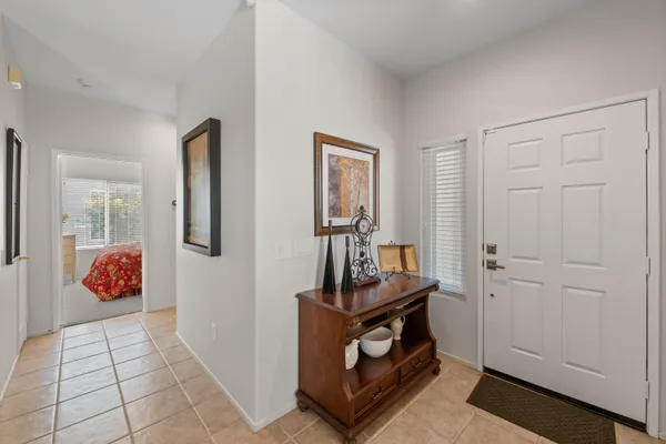 a living room with furniture and a dining table