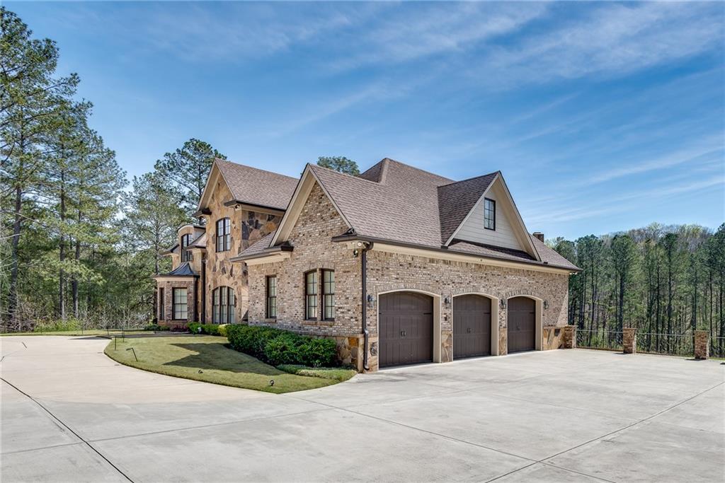 187 Fontaine Road Southwest Mableton, GA 30126 - Photo 4 of 84 a front view of a house with a yard and garage