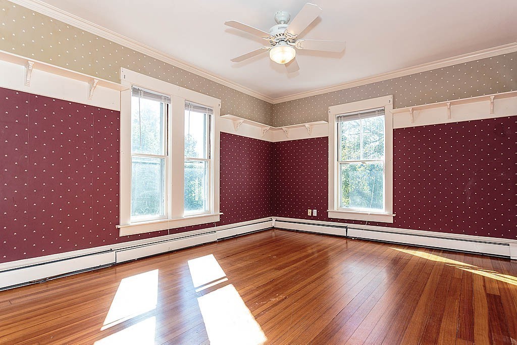 24 Old Ayer Road Groton, MA 01450 - Photo 15 of 29 an empty room with wooden floor and windows